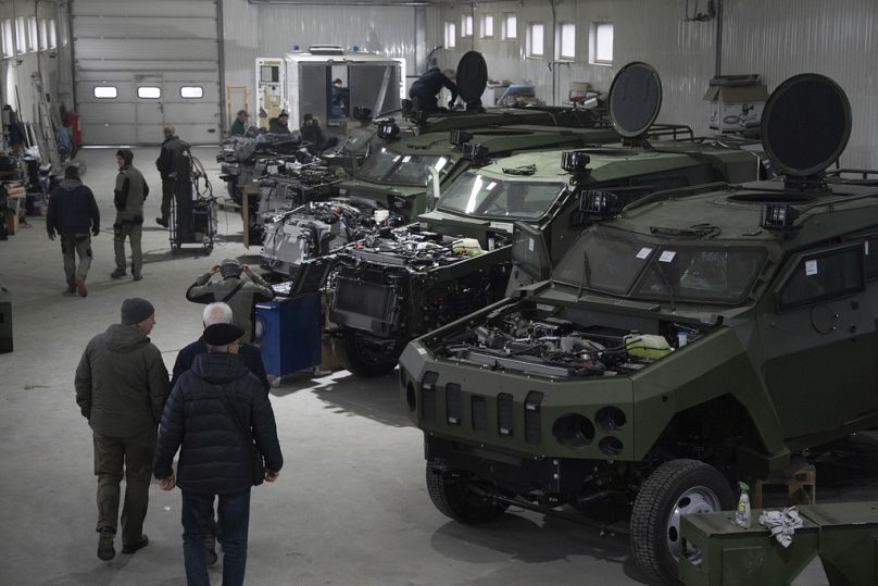 Armoured vehicles are worked on at a factory in Ukraine, on Friday, December 22, 2023.