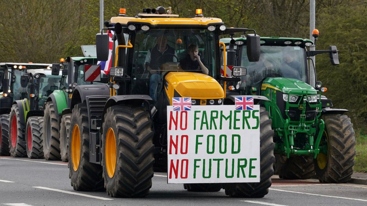 A convoy of farmers in tractors gather on the A20, near Wrotham, in Kent, England, 24 March 2024.