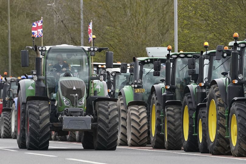 A convoy of farmers in tractors gather on the A20, near Wrotham, in Kent, England, Monday March 25, 2024.