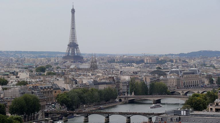 A view of the Eiffel tower along the Seine River in Paris, Friday, Aug. 22, 2013. (AP Photo/Michel Euler)