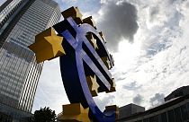 In this July 31, 2012 file photo the euro sculpture stands in front of the headquarters of the European Central Bank, ECB, in Frankfurt, Germany. 