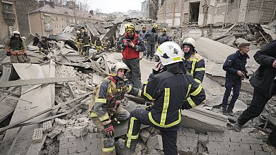 First response officers inspect the damage after a Russian air attack in Kyiv on Monday, February, 26, 2024.