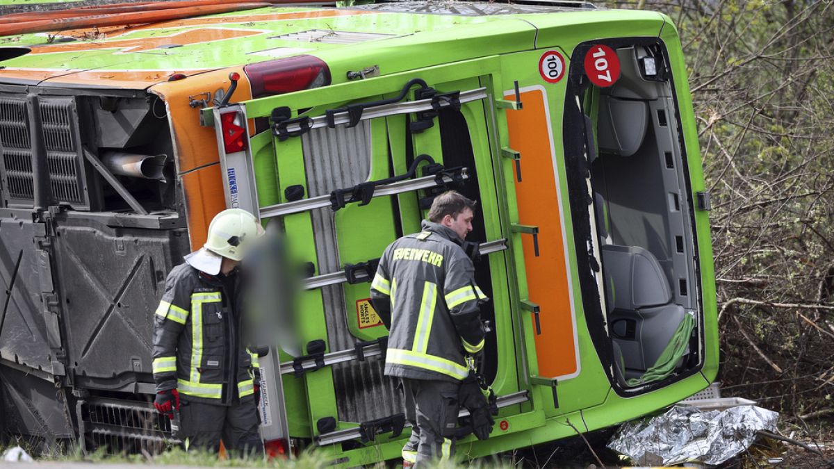 A coach lies overturned on its side at the scene of an accident on the A9, near Schkeuditz, Germany, Wednesday March 27. 2024.