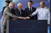 France's President Emmanuel Macron and Brazilian President Luiz Inacio Lula da Silva  symbolically activate the submarine during the launch ceremony March 27, 2024.