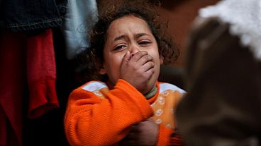 FILE - a young Palestinian girl cries at the funeral of her six-year old relative, 2007. 