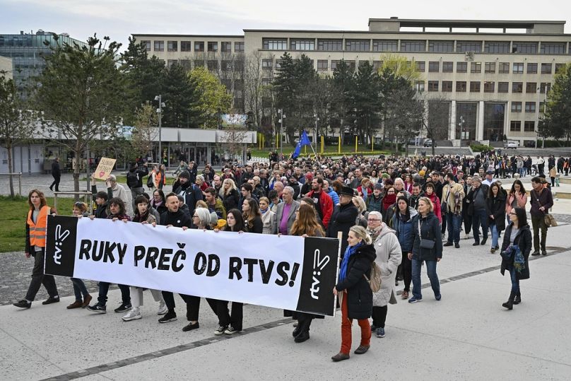 Demonstrator hold a banner reading "Hands off rtvs (Slovakian public radio and tv) " as they take part in a protest organised by the Slovakian opposition in Bratislava.