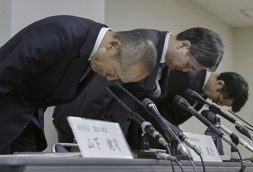Akihiro Kobayashi, President of Kobayashi Pharmaceutical Co., left, bows during a press conference in Osaka, on March 22, 2024