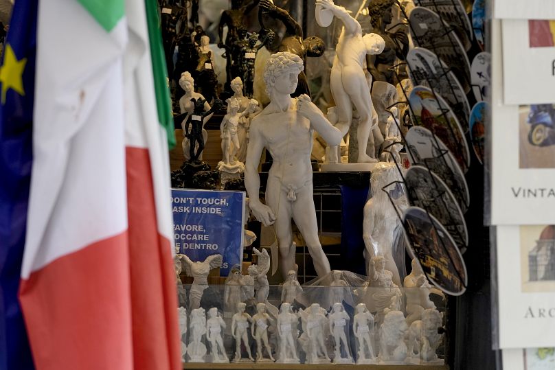 Souvenirs of Michelangelo's 16th century statue of David are seen on sale among other souvenirs in a shop in downtown Florence