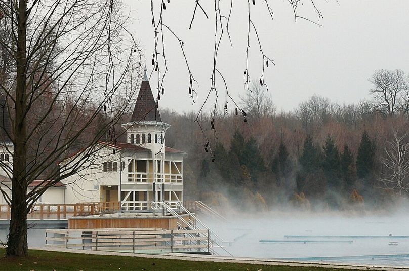 Steaming hot: Lake Heviz - pictured here in the winter - is toasty all year round