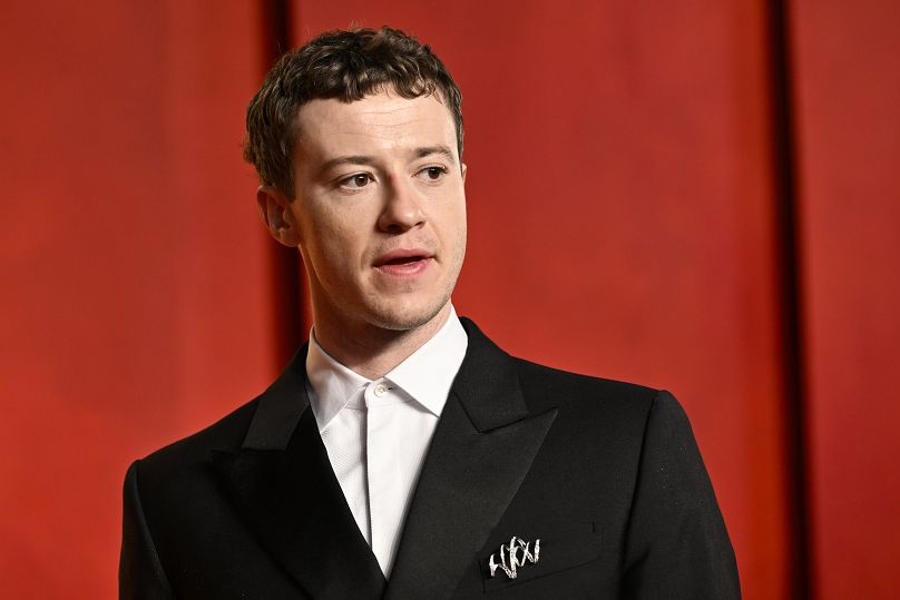 Joseph Quinn arrives at the Vanity Fair Oscar Party on Sunday, March 10, 2024, at the Wallis Annenberg Center for the Performing Arts in Beverly Hills, Calif.