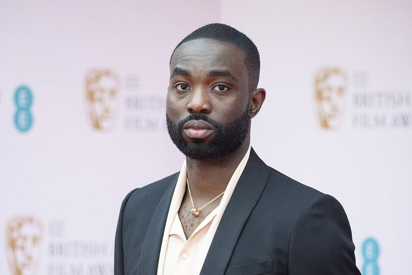 Paapa Essiedu poses for photographers upon arrival at the 75th British Academy Film Awards, BAFTA's, in London Sunday, March 13, 2022.