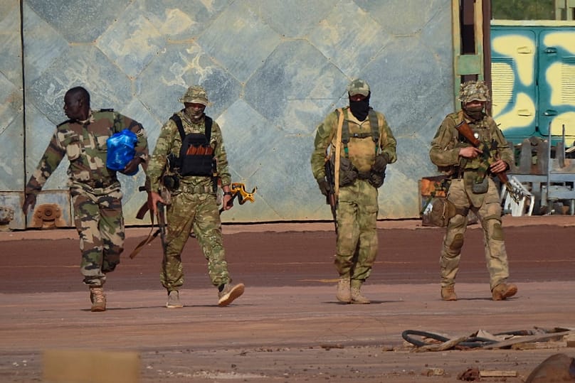 FILE - This undated photograph provided by the French military shows three Russian mercenaries, in northern Mali. 