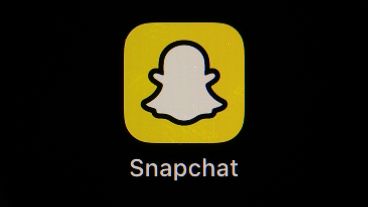 The icon for instant messaging app Snapchat is seen on a smartphone.