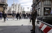 A soldier patrols in front of Milan gothic cathedral in Milan, Monday, March 25, 2024