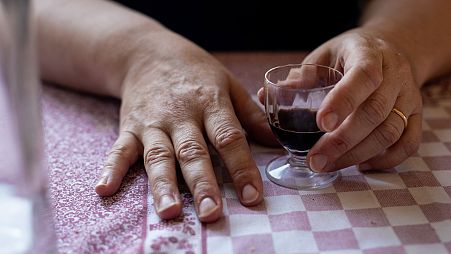 Valentina's hands on her kitchen table.