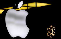 The Apple logo is illuminated at a store in Munich, Germany, Monday, November 13, 2023