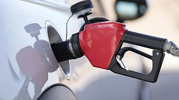 Fuel is pumped into a vehicle at a Costco gasoline station on Nov. 30, 2023, in Thornton, Colo.