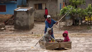 People paddle through floodwaters after cyclone Gamane hit northern Madagascar, March 28th 2024
