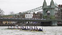 Oxford, right, and Cambridge pass under Hammersmith Bridgeduring the 168th Men's Boat Race 2023 on the River Thames, London, Sunday March 26, 2023.