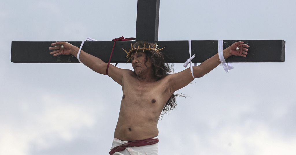 A Filipino villager is nailed to a cross for the 35th time on Good Friday