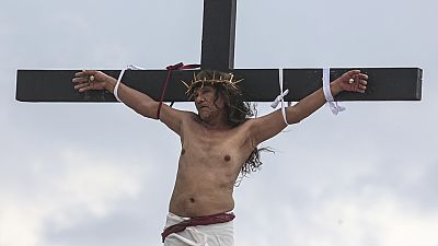 A Filipino villager is nailed to a cross for the 35th time on Good Friday