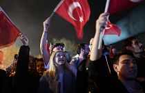 Supporters listen to Istanbul Mayor and Republican People's Party, or CHP, candidate Ekrem Imamoglu outside the City Hall in Istanbul, Turkey, early Monday, April 1, 2024.