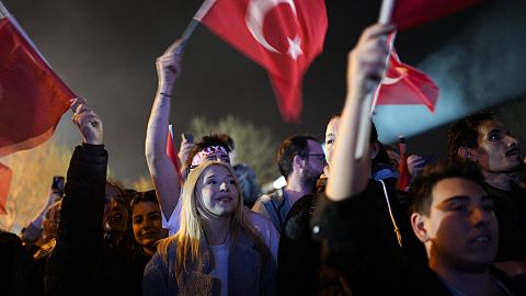 Supporters listen to Istanbul Mayor and Republican People's Party, or CHP, candidate Ekrem Imamoglu outside the City Hall in Istanbul, Turkey, early Monday, April 1, 2024.