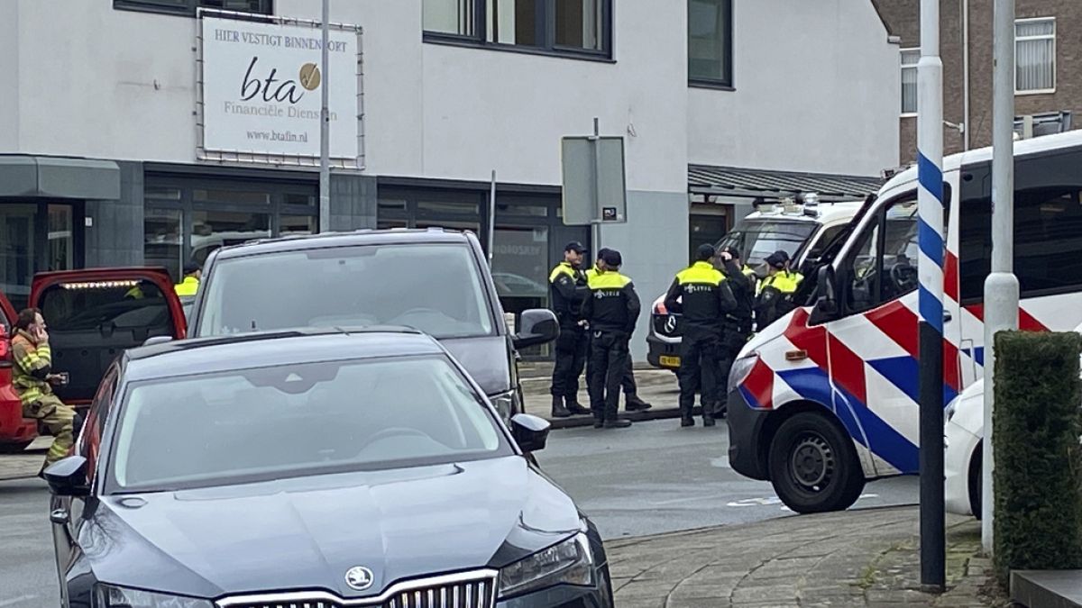 Police gather in Eden, Netherlands, Saturday, March 30, 2024. Heavily armed police have cordoned off part of a Dutch town and say that multiple people are being held hostage i