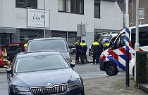 Police gather in Eden, Netherlands, Saturday, March 30, 2024. Heavily armed police have cordoned off part of a Dutch town and say that multiple people are being held hostage i