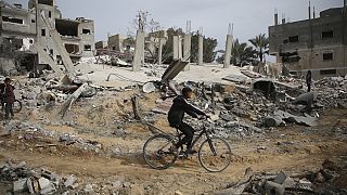 Palestinians inspect the ruins of a residential building for the Abu Muammar family after an Israeli airstrike in Rafah, southern Gaza Strip, Friday, March 29, 2024. 