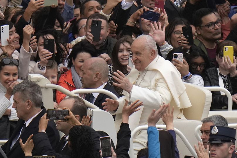 Pope Francis waves faithful after celebrating Easter mass in St. Peter's Square at the Vatican, Sunday, March 31, 2024.