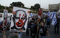 People take part in a protest against Israeli Prime Minister Benjamin Netanyahu's government  in Jerusalem, Sunday, March 31, 2024. 