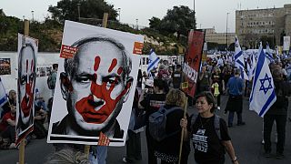 People take part in a protest against Israeli Prime Minister Benjamin Netanyahu's government  in Jerusalem, Sunday, March 31, 2024. 