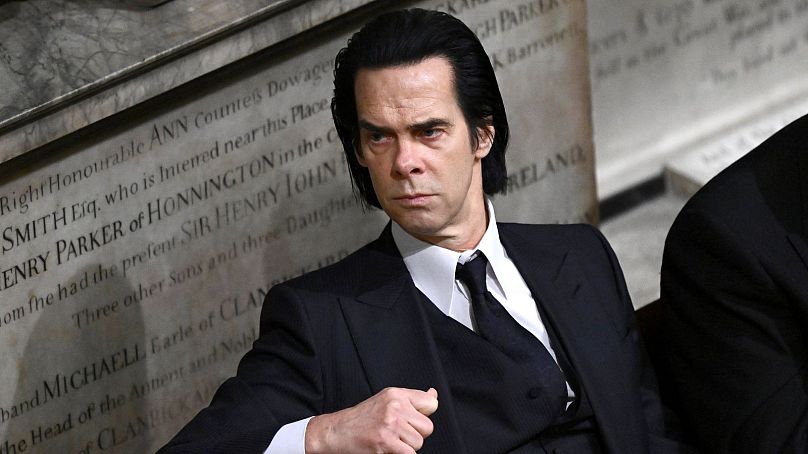 Nick Cave attends the coronation of King Charles III at Westminster Abbey - May 2023