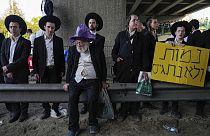 Ultra-Orthodox Jews block a highway during a protest against army recruitment, near Bnei Brak, Israel,
