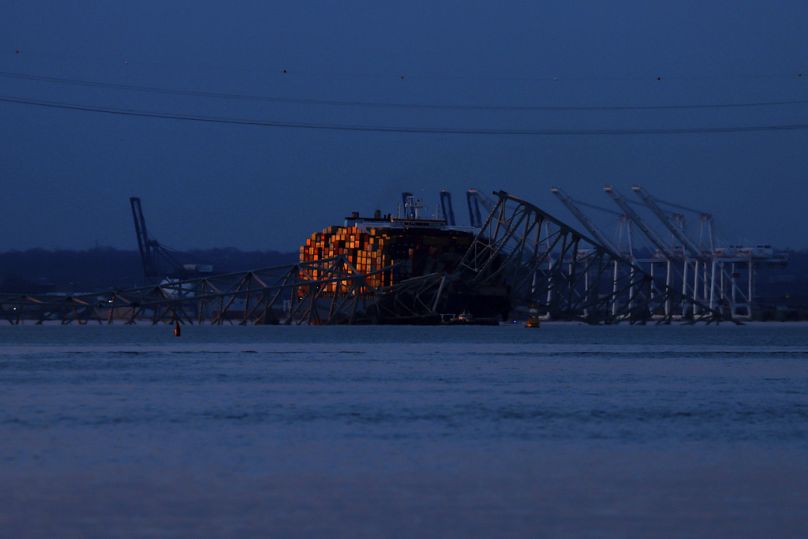 Wreckage of the Francis Scott Key Bridge rests on the container ship Dali.