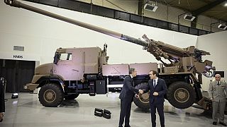 Antony Blinken and French Defence Minister, Sebastien Lecornu, shake hands as they visit arms manufacturer NEXTER that provides Caesar artillery to Ukraine in Versailles