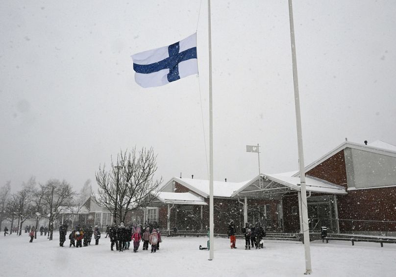 The flag of Finland flies at half-mast at the Viertola school in Vantaa, Finland, on Wednesday, April 3, 2024.