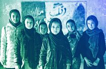 Afghan schoolgirls pose for a photo in a classroom in Kabul, December 2022