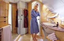 A woman after a shower in Emirates' first class 