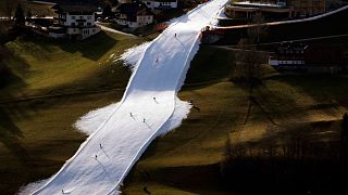 People ski on a slope near Schladming, Austria, 6 January 2023.
