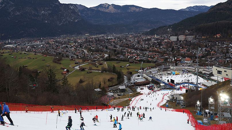Competitors inspect the small strip of snow where they will compete in an alpine ski, men's World Cup slalom race, in Garmisch Partenkirchen, Germany, 4 January 2023.