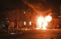A firefighter's vehicle is seen in flames after Russian drone strikes on a residential neighborhood in Kharkiv, Ukraine, Thursday, April 4, 2024.