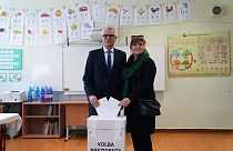 FILE - Presidential candidate Ivan Korcok and his wife Sona cast their votes during the first round of the presidential election in Senec, Slovakia, Saturday, March 23, 2024.