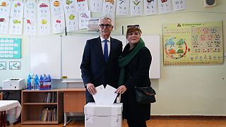 FILE - Presidential candidate Ivan Korcok and his wife Sona cast their votes during the first round of the presidential election in Senec, Slovakia, Saturday, March 23, 2024.