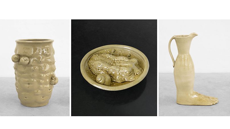 (L to R) "Stoneware jar with body fragments and snails, 2023", "Stoneware dish with toad, snails and taps" and "Stoneware vessel, 2023" by Daniel Dewar and Grégory Gicquel.