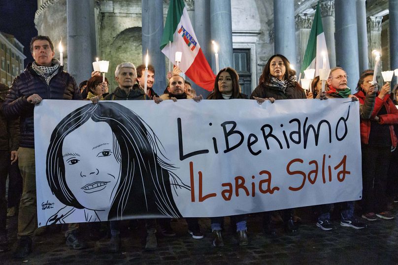 Demonstrators hold up a banner with writing reading in Italian "Lets free Ilaria Salis", in front of the Pantheon monument, in Rome, Wednesday, Feb. 14, 2024