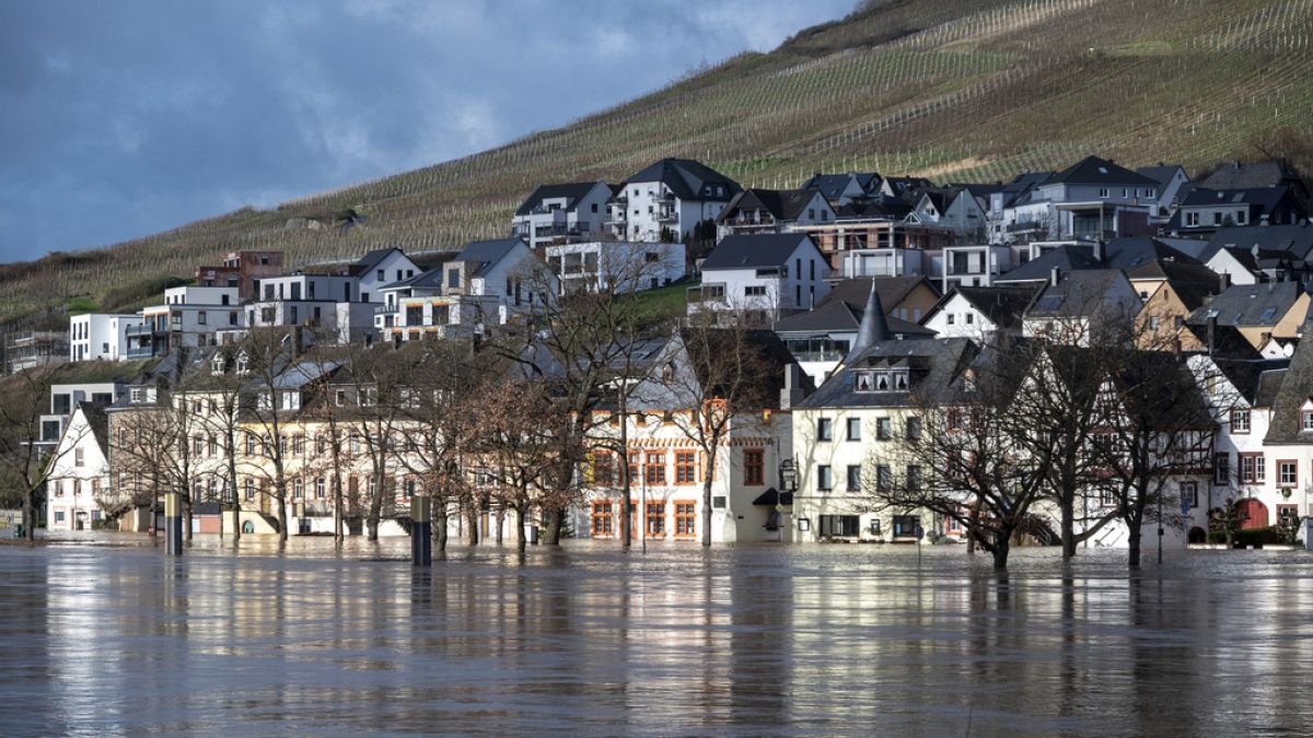 The high water level of the river Moselle has reached numerous houses along the banks in the Kues district Bernkastel-Kues, Germany, Thursday, Jan. 4, 2024. 