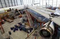 Employees work on an aircraft at the Elbe Aircraft Factory during a visit of German chancellor Olaf Scholz in Dresden, Germany, Thursday, Feb. 29, 2024. 