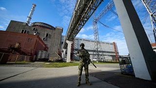 FILE - A Russian serviceman guards an area of the Zaporizhzhia Nuclear Power Station in territory under Russian military control, southeastern Ukraine, on May 1, 2022. 